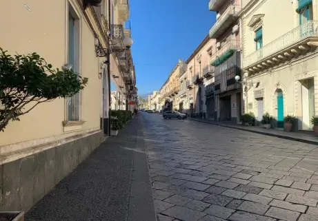 Via Callipoli in Giarre with buildings overlooking the paved street Via Callipoli in Giarre with buildings overlooking the paved street