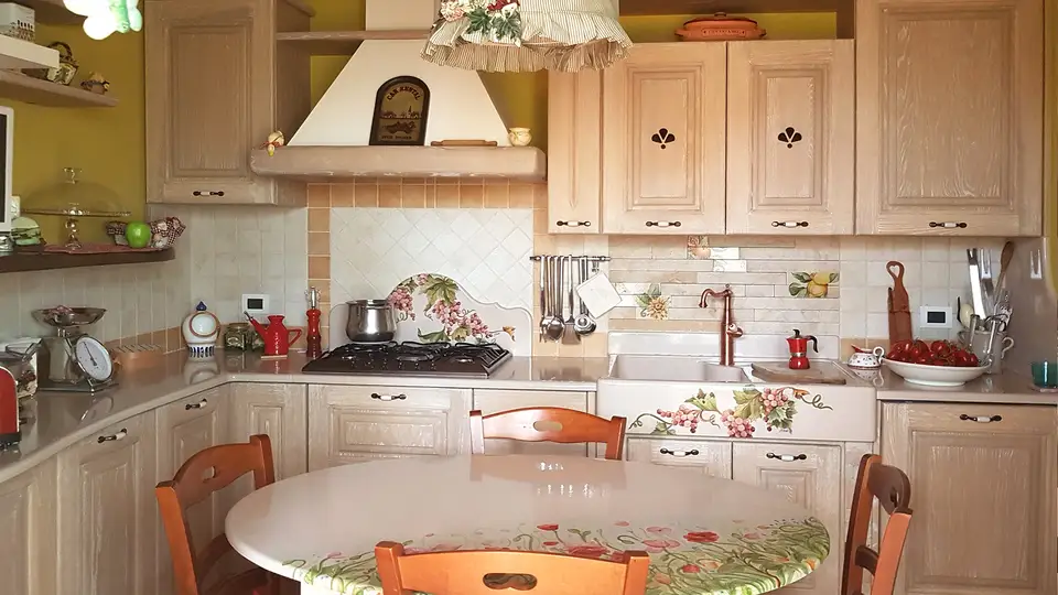 Lava stone kitchen worktop with hand-painted poppies and grapes