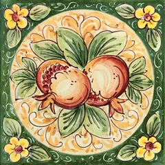 Decorated tile with two pomegranates and green leaves in an ochre medallion, with a green frame and small yellow corner flowers