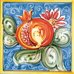 Decorated tile with an open pomegranate, a pink flower and large green leaves on pale blue with white curls and a yellow border
