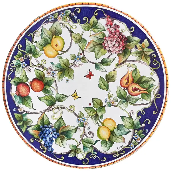 table en pierre de lave avec décor bleu de citrons et de raisins