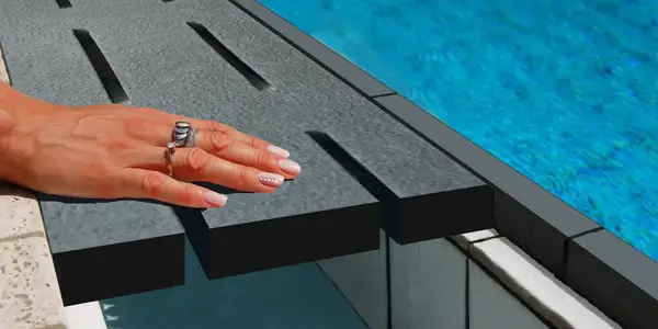 Detail of grooved lava stone for swimming pool edges
