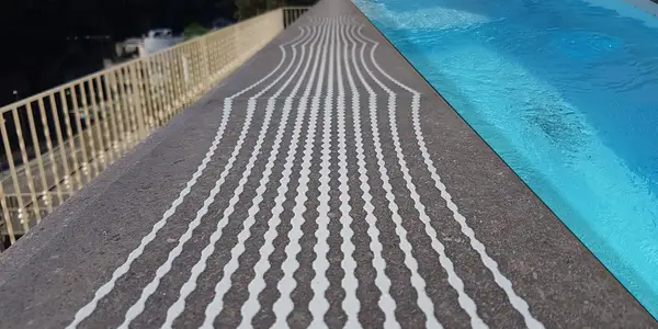 Screen-printed swimming pool edge on lava stone