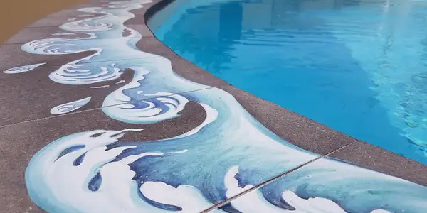 Swimming pool finished with ceramized lava stone elements