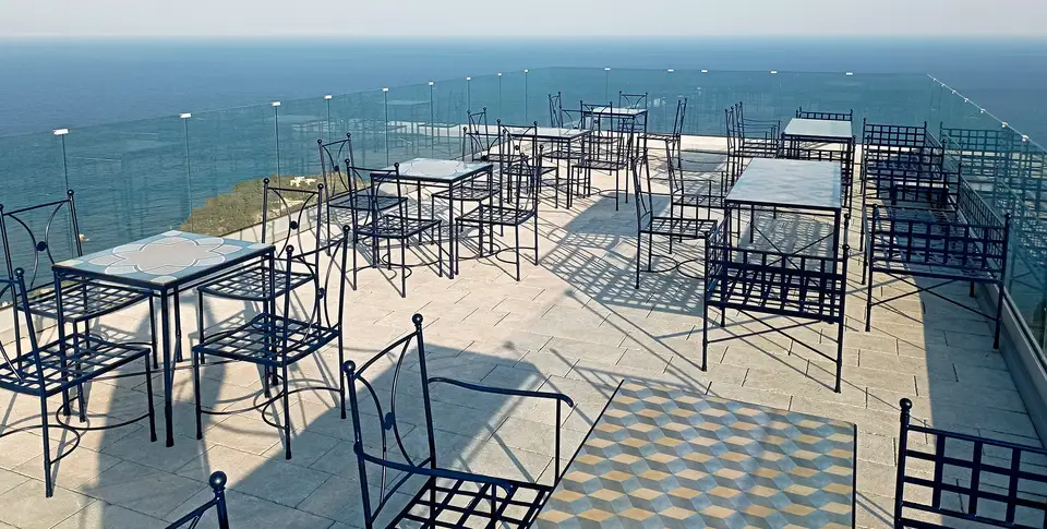 Decorated lava stone tables in a restaurant in Taormina