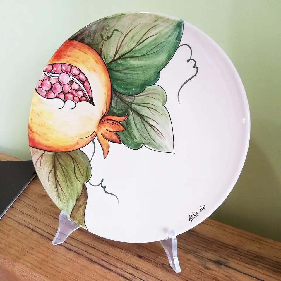 Hand-decorated ceramic hanging plate