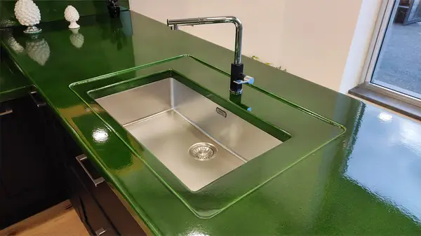 Corolla kitchen: stainless steel sink inset into the green lava stone countertop Corolla kitchen: stainless steel sink inset into the green lava stone countertop
