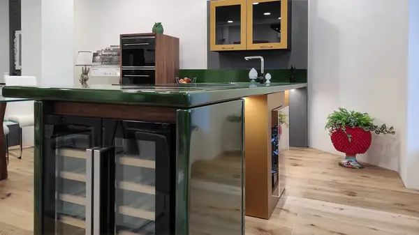 Corolla kitchen: green ceramicized lava stone peninsula Corolla kitchen: green ceramicized lava stone peninsula with an integrated wine cooler