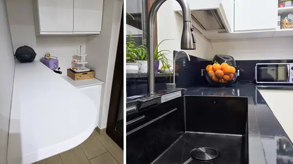 Trento kitchen: details of the white corner cabinet and sink in the black countertop