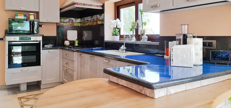 Pisa modern modular kitchen with a peninsula and blue ceramicized lava stone countertop