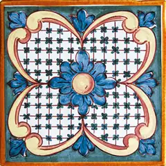 Decorated tile with a central blue flower, four green lattice sections outlined in pink and cream and a dark green frame