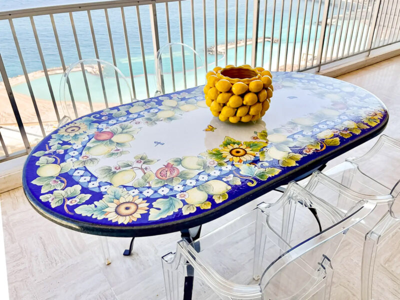 blue oval table with sunflowers