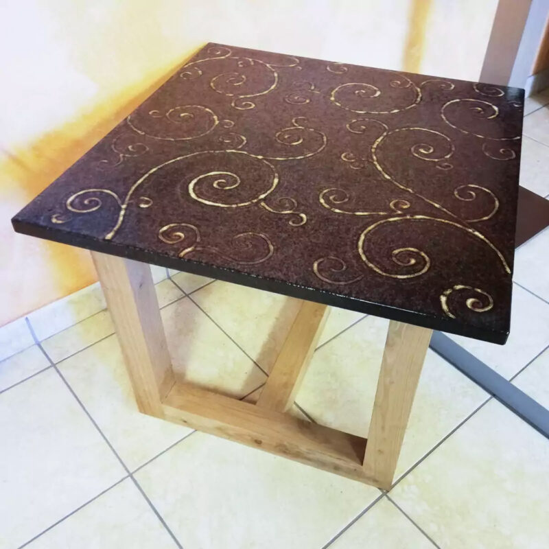 modern table in copper-colored lava stone and hand-made decoration