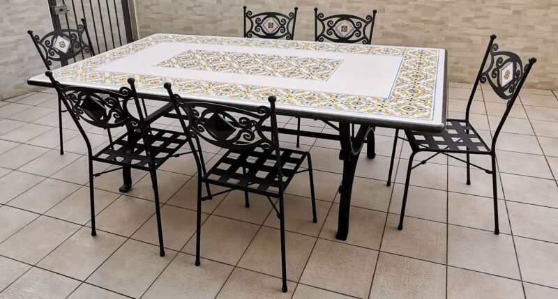 rectangular table with iron chairs decorated